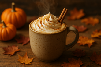 Homemade Pumpkin Spice Latte in a rustic mug with whipped cream and cinnamon sprinkle